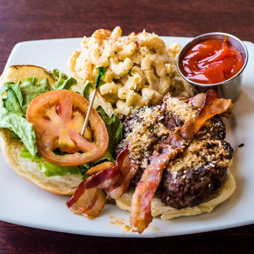 Elmwood Inn's bacon cheeseburger with lettuce, tomato, macaroni and cheese, and ketchup.